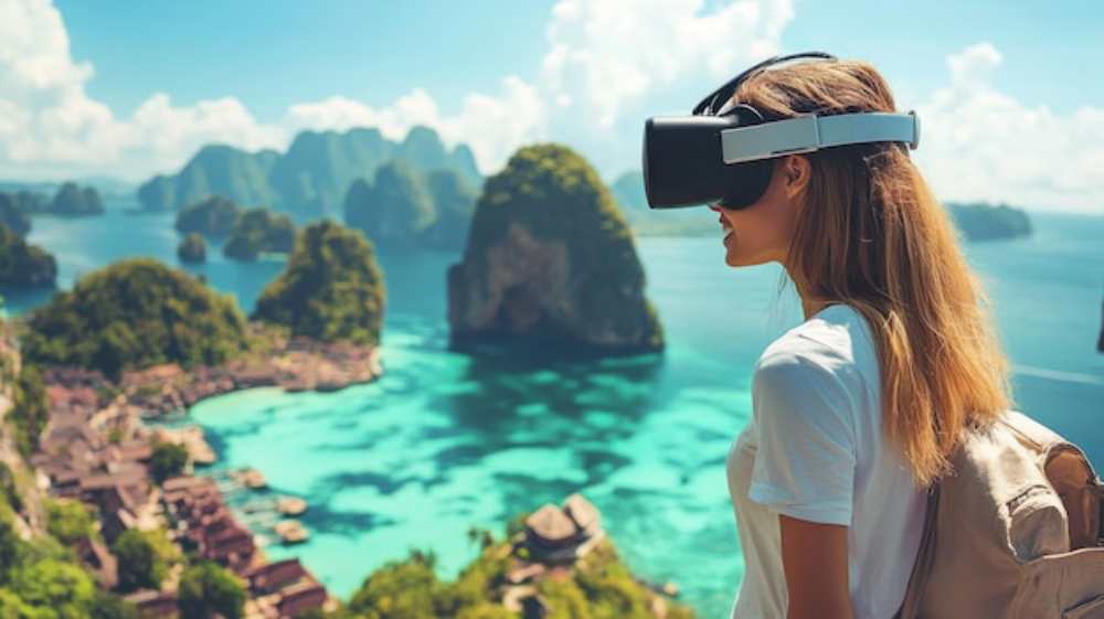 A person wearing a VR headset stands on a cliff, overlooking a stunning turquoise bay surrounded by lush green islands.